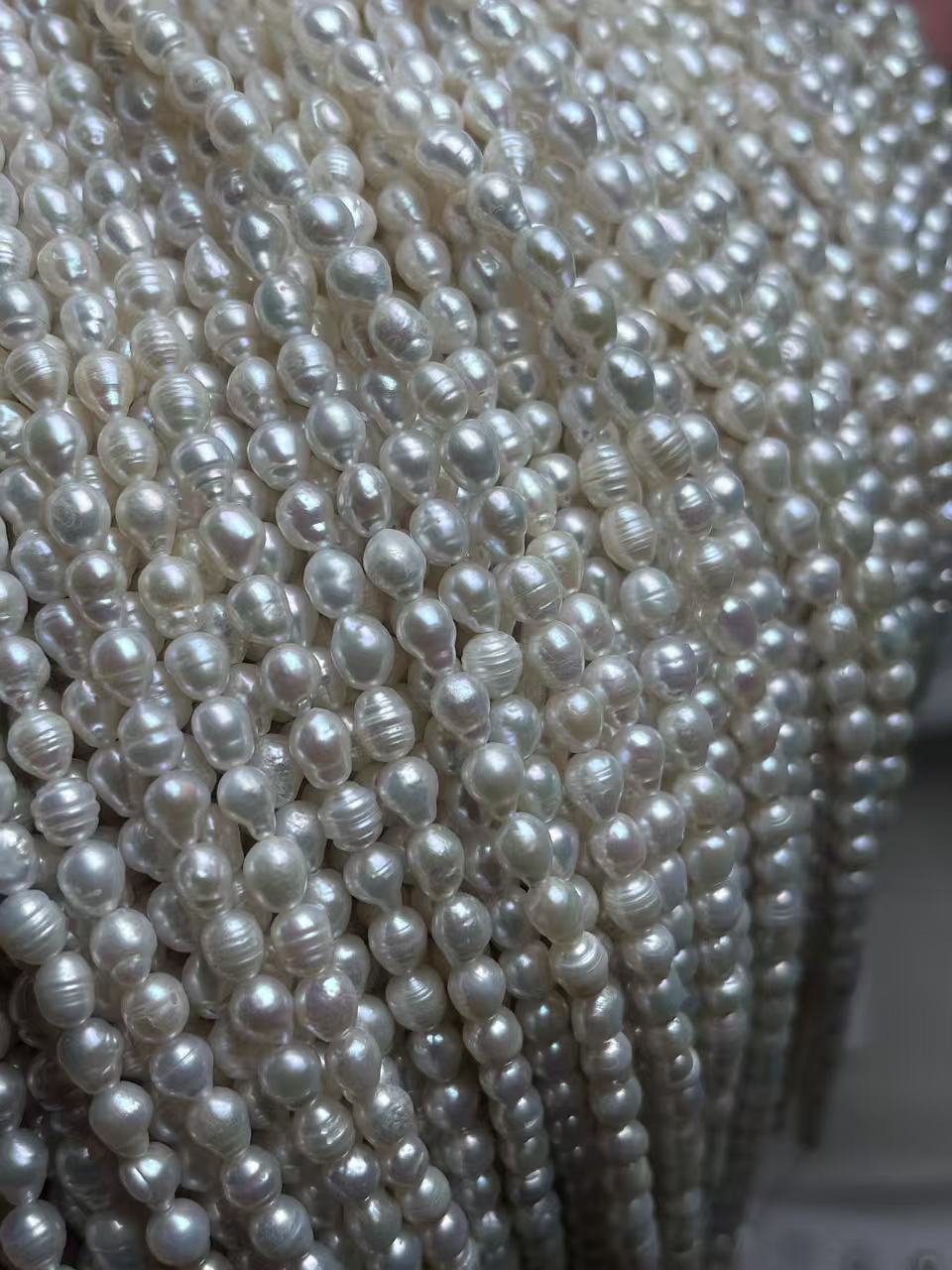 2–2.5 mm White Ribbed Rice Pearl Strand · 3A — supplied lot image 1
